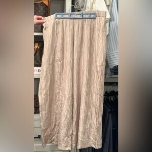 Elegant, flattering Silk wide leg pant with elastic waist band.